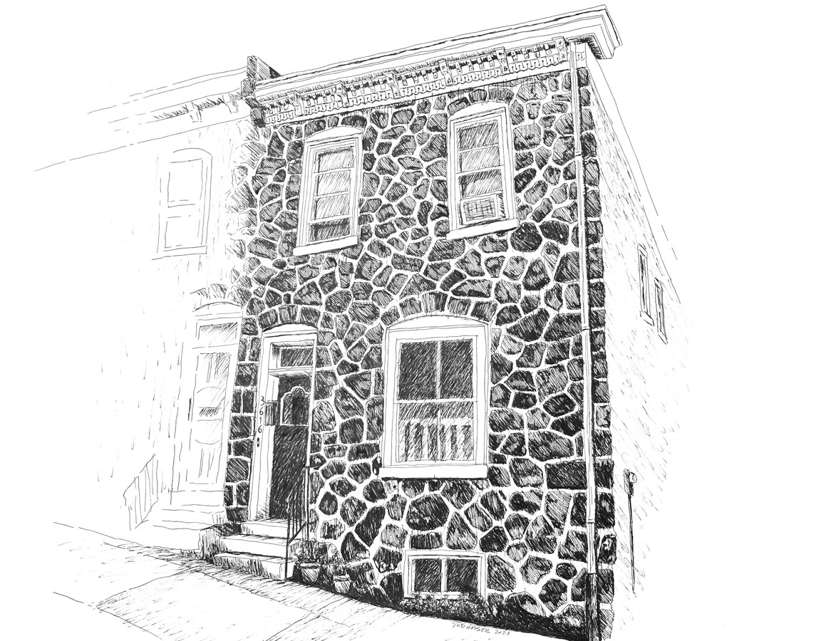 East Falls row home with flat stoned front facade.